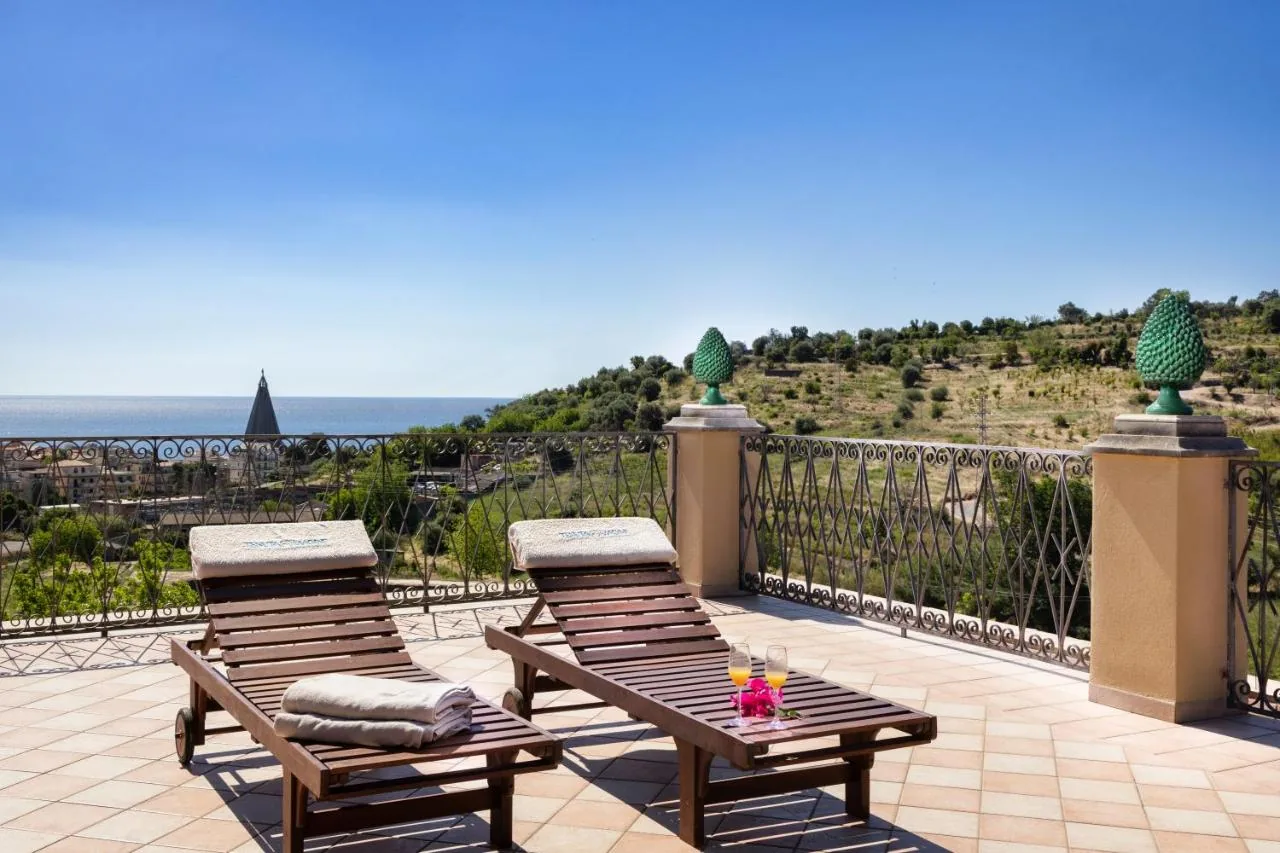Terrace with sun loungers and sea view
